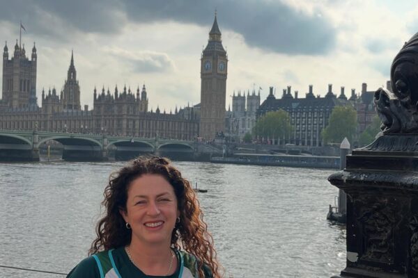 Lisa smiling with Big Ben in background and the river Thames.