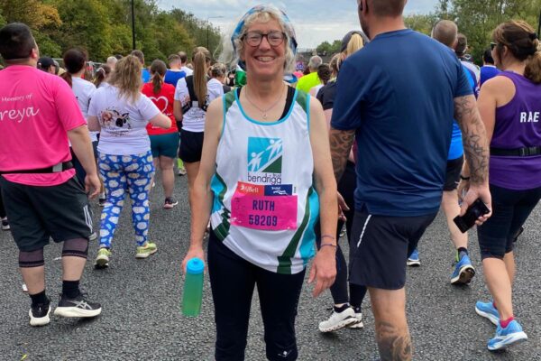 Smiley Ruth ready to start the Great North Run, water in hand and Bendrigg running vest on! Go Ruth